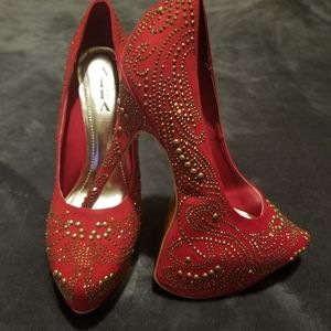 Red and gold studded platform pump